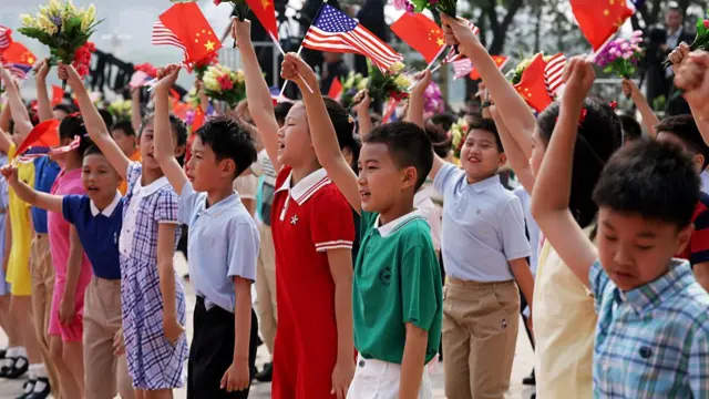 Children waving mini-flags and bouquets