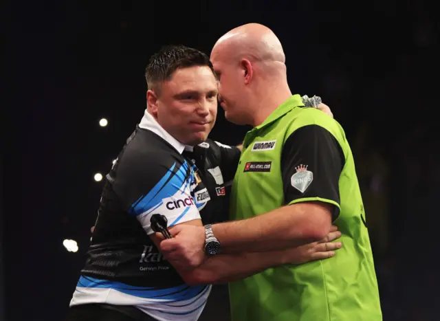 Gerwyn Price embracing Michael van Gerwen
