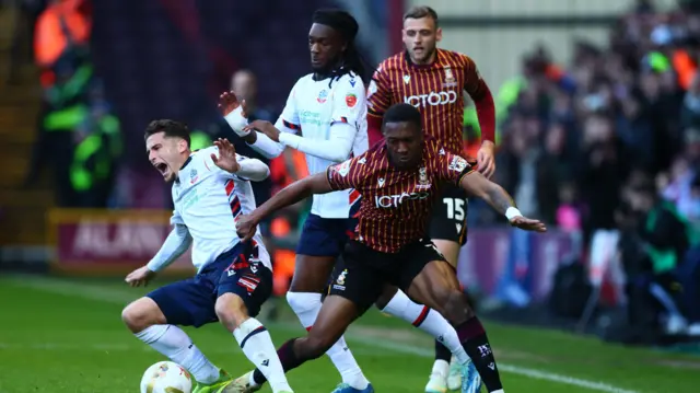 Josh Neufville of Bradford City fouls Ruben Rodrigues of Bolton Wanderers