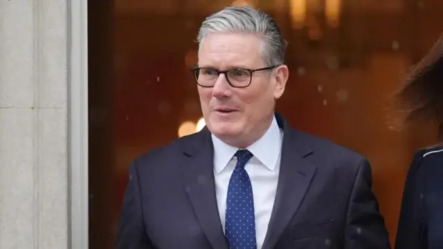 Keir Starmer pictured in the rain on Wednesday