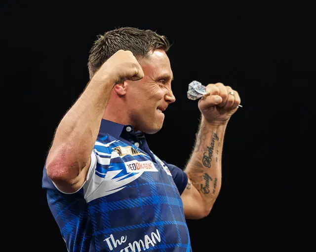 Gerwyn Price flexing his biceps