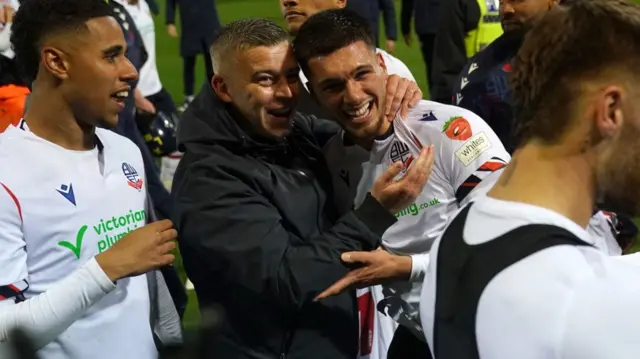 Xavier Simons celebrates with manager Steven Schumacher