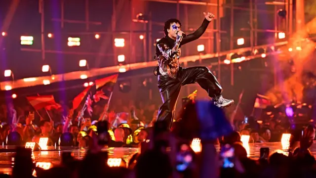 Austrian singer Benjamin Gedeon, aka Cosmo and representing Austria with the song 'Tanzschein', performs during the second semi-final of the Eurovision Song Contest 2026