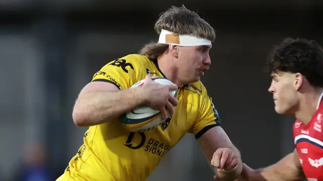 Aaron Wainwright runs with the ball for Dragons against Scarlets