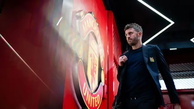 Michael Carrick walks through the tunnel at Old Trafford
