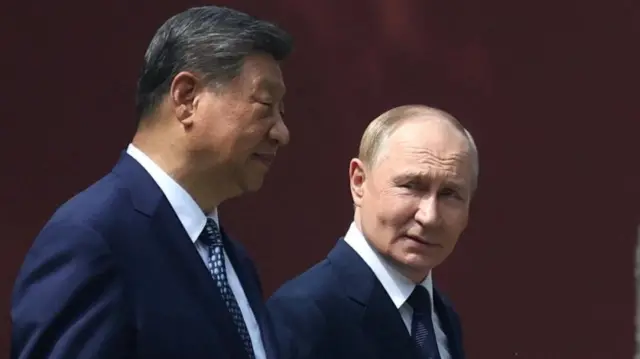 Xi and Putin walking side by side