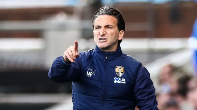 Martin Paterson points on the Notts County sideline