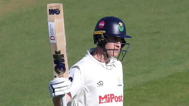 Glamorgan batter Ben Kellaway raises his bat