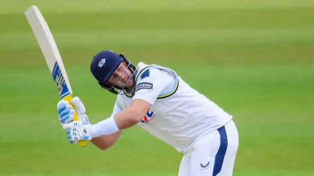 Yorkshire's Joe Root whips a shot away behind him into the leg side against Surrey.