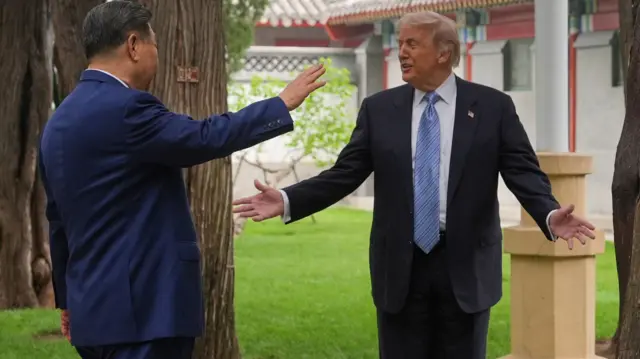 President Donald Trump talks with China’s President Xi Jinping at the Zhongnanhai leadership compound