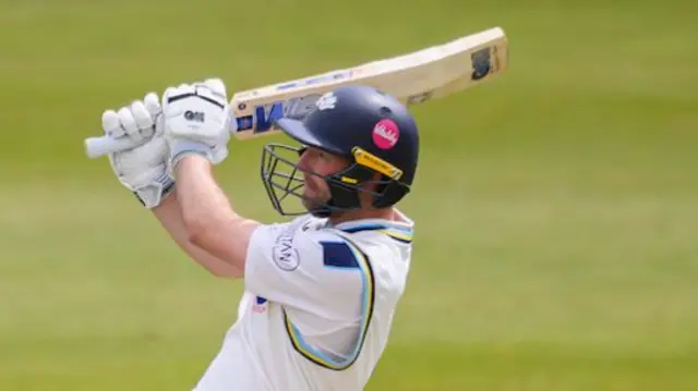 Yorkshire's Adam Lyth hits out into the leg side against Surrey.