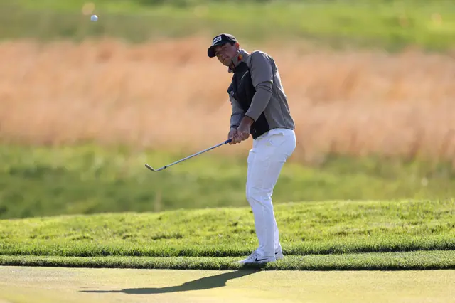 Viktor Hovland chips out of the rough