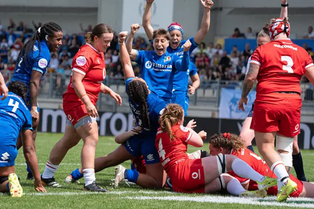Italy celebrate a try against Wales