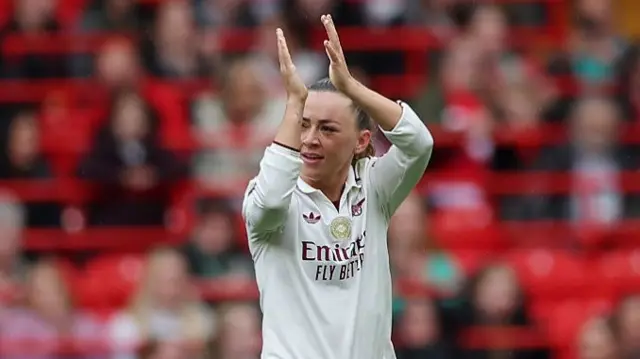 Katie McCabe of Arsenal acknowledges the fans a