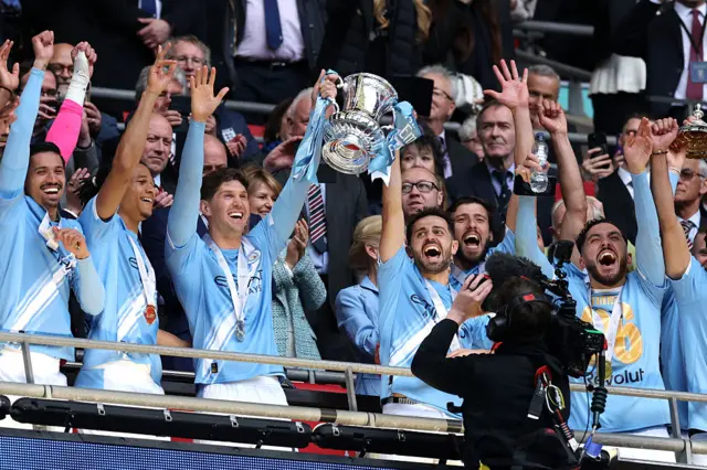 Manchester City lift the FA Cup trophy