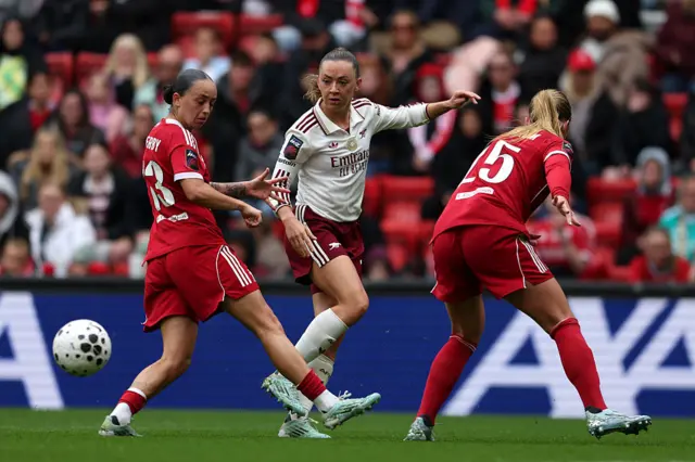 Katie McCabe passes the ball