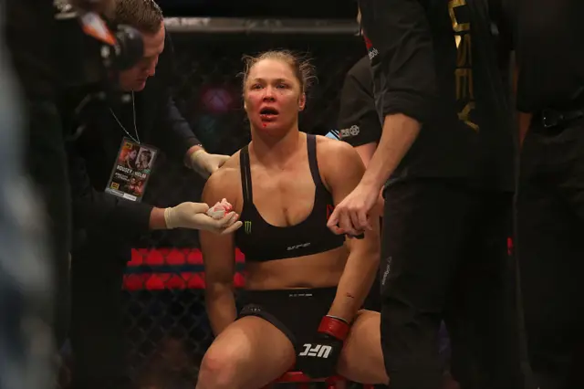 Ronda Rousey looks dejected after her defeat by Holly Holm in 2015
