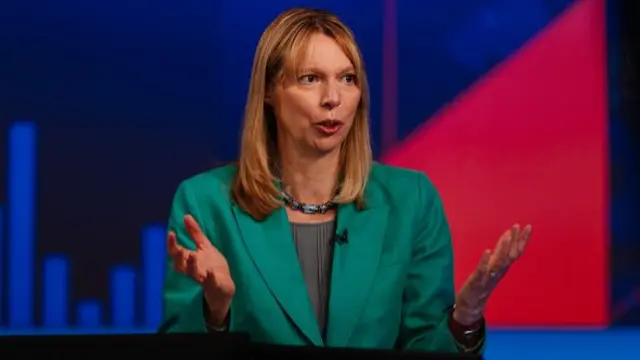 Baroness Cavendish in a green blazer on a TV studio set