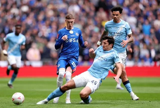 Cole Palmer of Chelsea is challenged by Abdukodir Khusanov