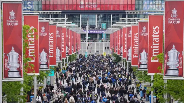 Fans on Wembley Way ahead of the Emirates FA Cup final at Wembley Stadium