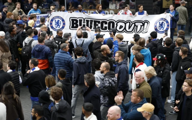 Chelsea fans with a banner outside the stadium
