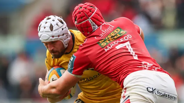 Harri Keddie carries the ball for Dragons against Scarlets