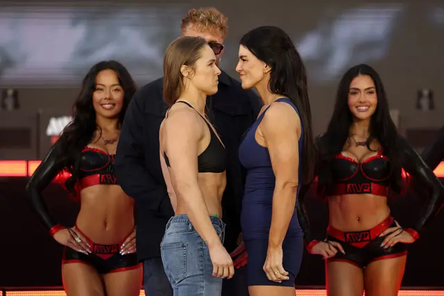 Ronda Rousey facing off with Gina Carano