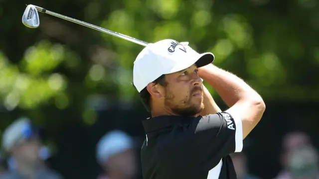 Xander Schauffele drives from the tee