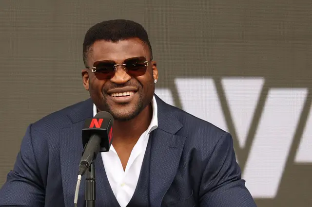 Francis Ngannou smiling at news conference