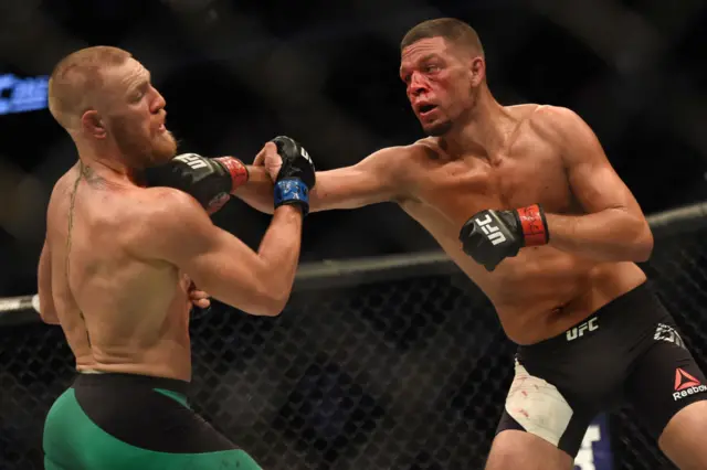 Nate Diaz lands a punch on Conor McGregor