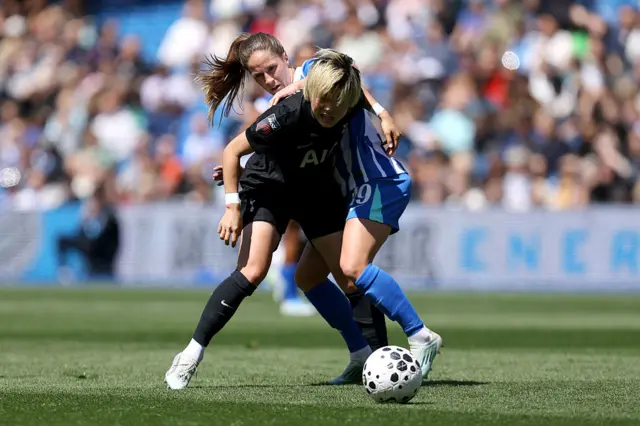 Maika Hamano tries to hold onto possession