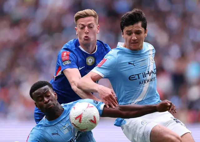 Liam Delap battles for the ball