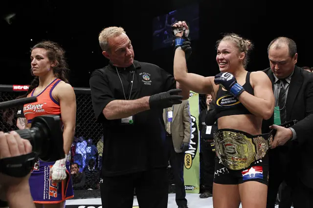 Ronda Rousey has the Strikeforce bantamweight title wrapped around her waist