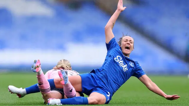 Aurora Galli of Everton reacts after a challenge from Emily van Egmond