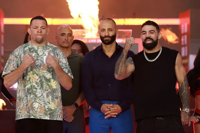 Nate Diaz and Mike Perry posing with clenched fists
