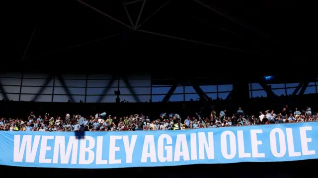 A sign held by the City fans at Wembley stadium
