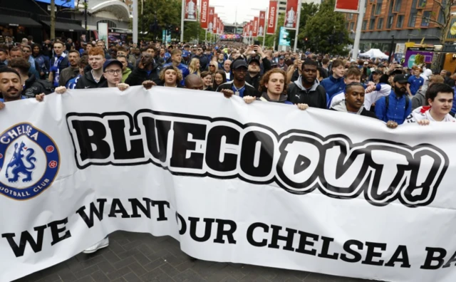 Chelsea fans with a banner outside the stadium
