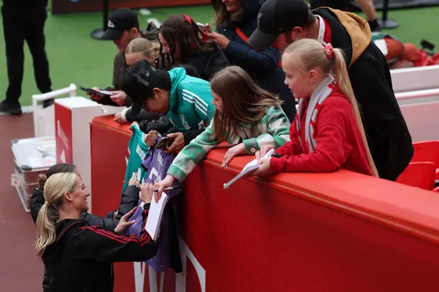 Bonner signs autographs before the game