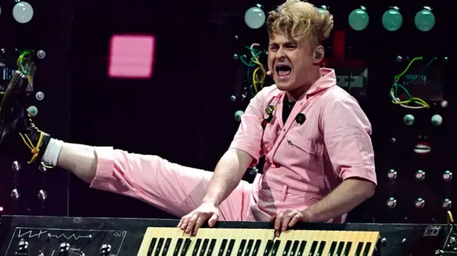 Sam Battle (Look Mum No Computer) on the stage with synthesizer