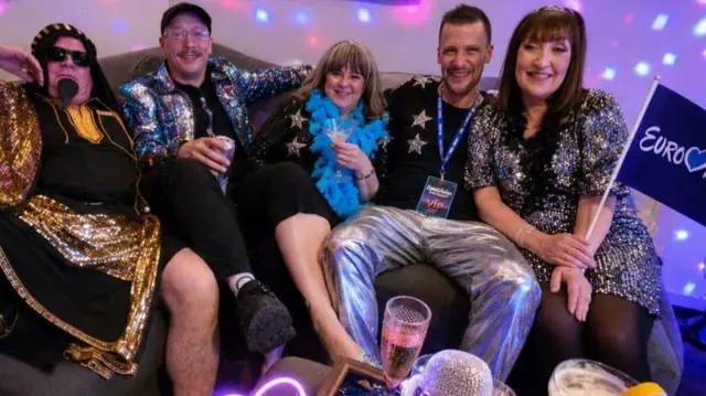 Eurovision fans in silver and sparkling clothes