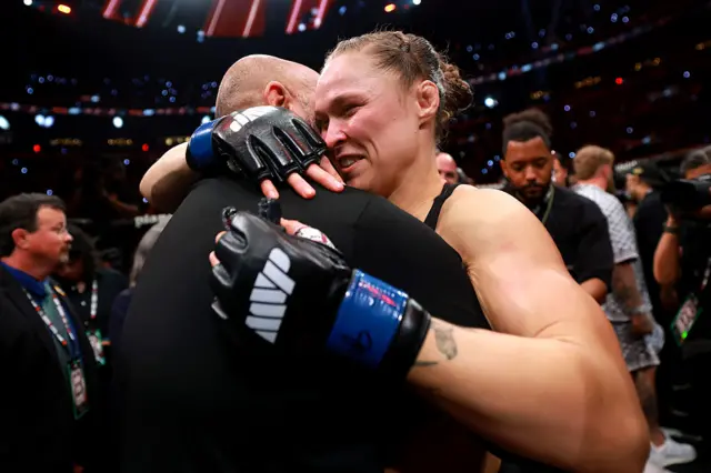 Ronda Rousey embracing with her husband Travis Browne