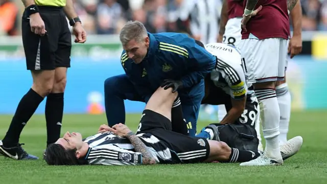 Sandro Tonali of Newcastle United receives medical treatment during the Premier League match between Newcastle United and West Ham United at St James' Park