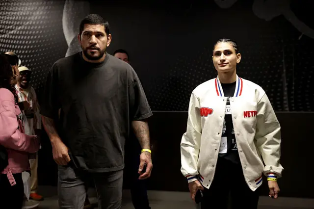 Alex and Aline Pereira backstage on a fight night