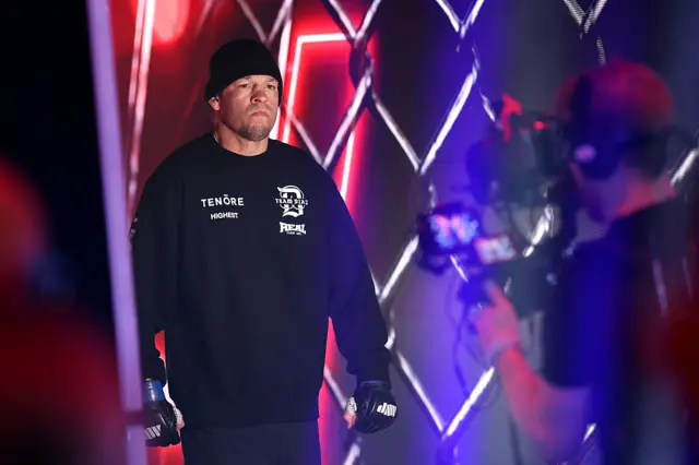Nate Diaz makes his entrance in a black beanie