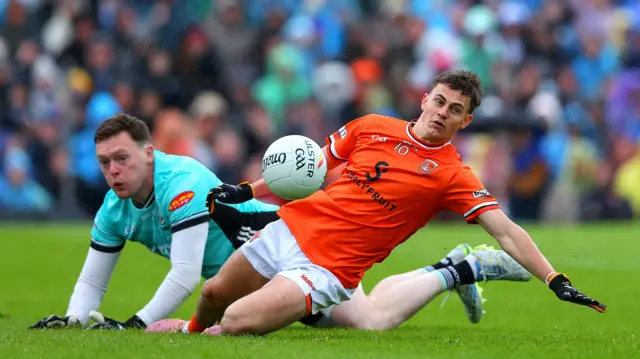 Armagh's Darragh McMullen with Rory Beggan of Monaghan