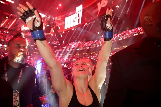 Ronda Rousey waving to her fans