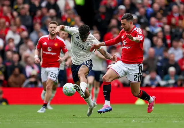 Dalot tries to get the ball clear