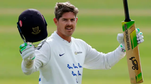 Daniel Hughes reaches his century