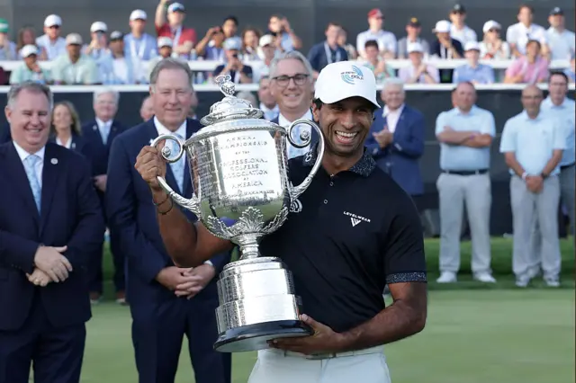 Aaron Rai lifts the trophy