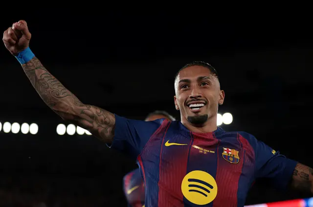 Raphinha celebrates scoring for Barcelona